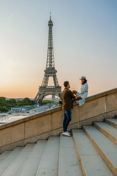 young-couple-by-eiffel-tower-600nw-2289363901